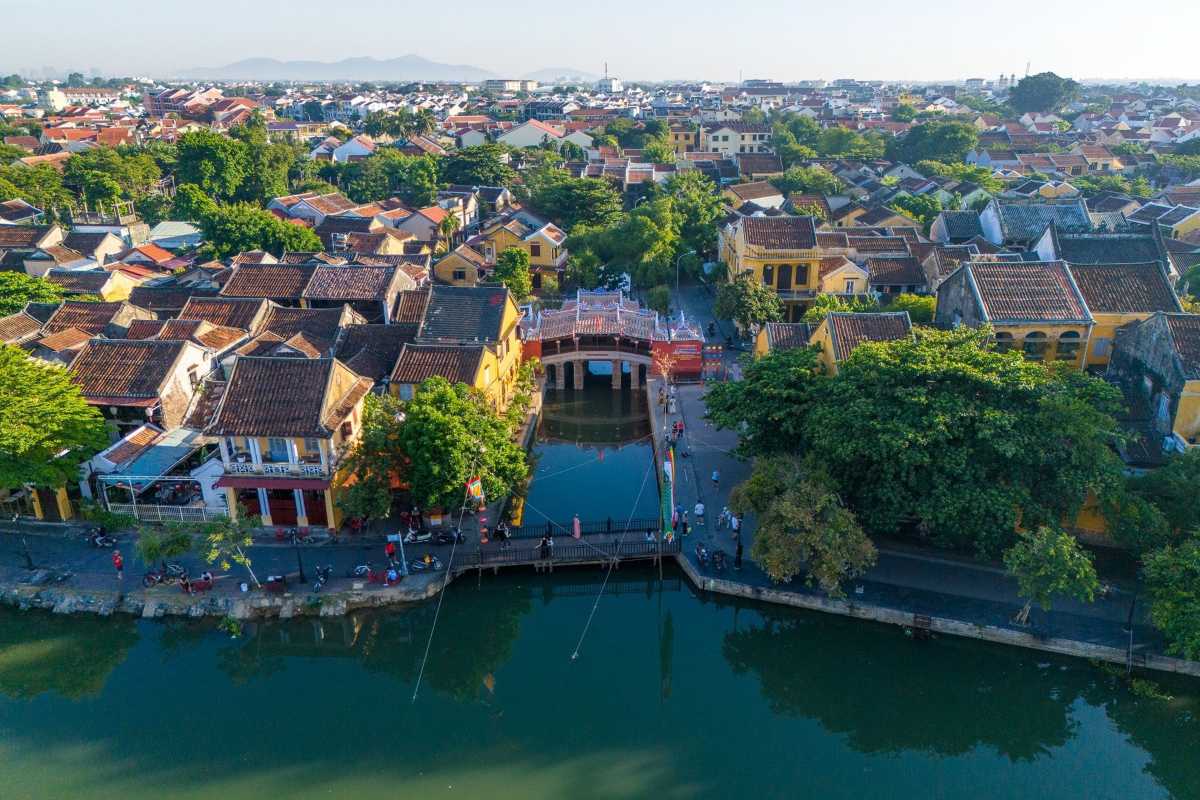 Japanese Bridge Hoi An reflected in calm water The Japanese Bridge Hoi An perfectly reflected in calm canal waters with vibrant colors