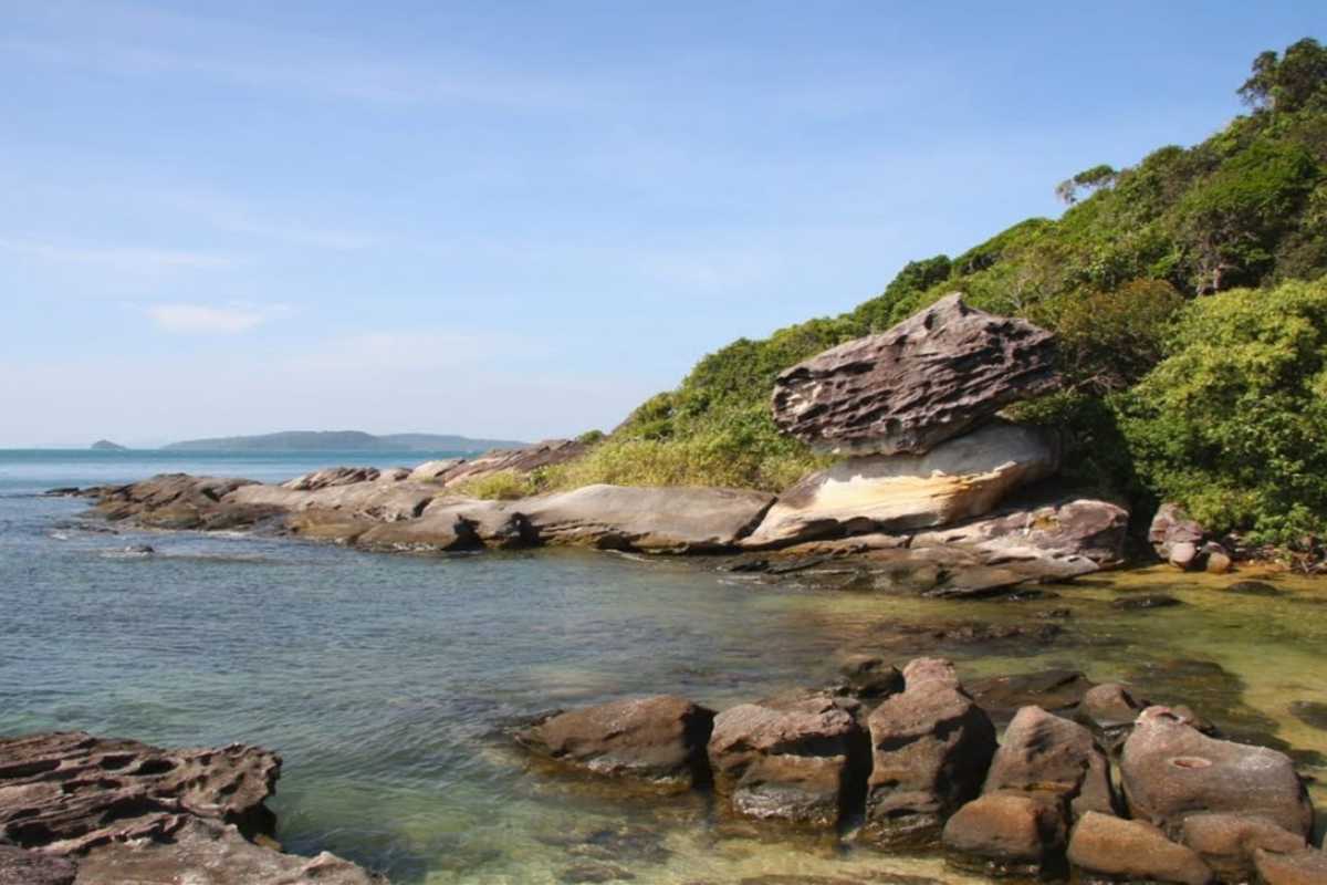 Rocky Coastline at Ganh Dau Cape The rocky coastline at Ganh Dau Cape, offering dramatic views of the ocean and surrounding hills.