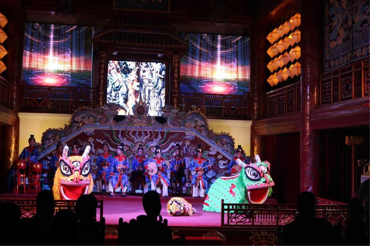 Royal Theatre Hue, Hue, night court music and lion dance show Nighttime court music and lion dance performance at Royal Theatre Hue, with vivid stage lights and traditional costumes.