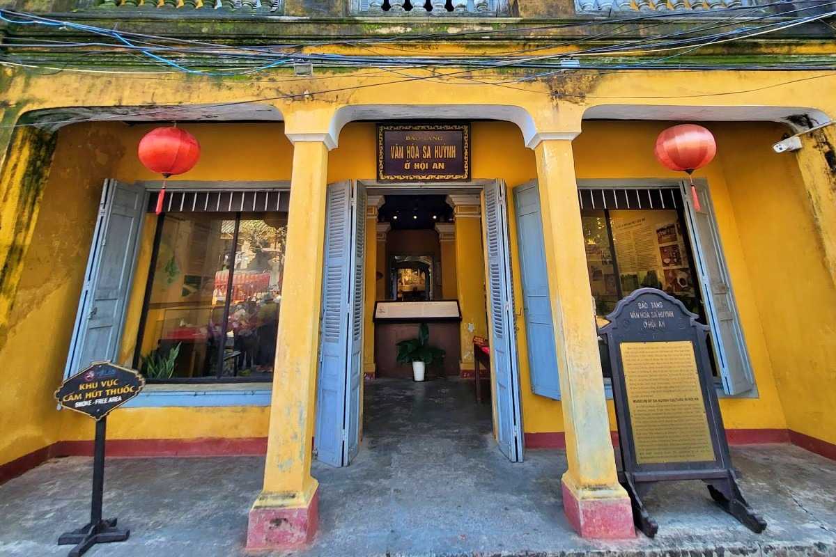 Museum Room Filled with Sa Huynh Artifacts and Displays Museum gallery with diverse Sa Huynh artifacts displayed on walls and in glass cases, Hoi An