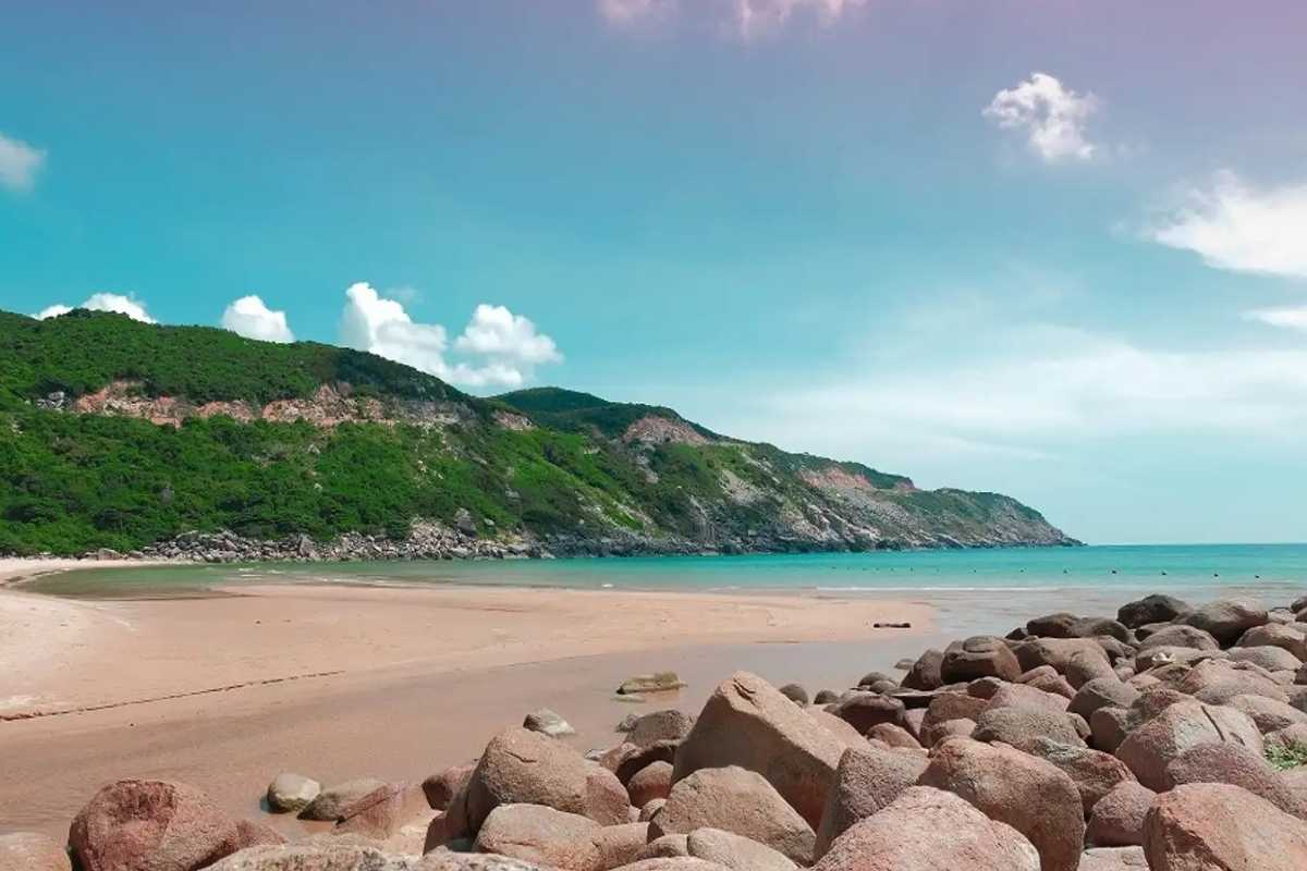 Sandy bay and forested hills at Dai Lanh Beach Wide sandy bay with forested hills in the background at Dai Lanh Beach, Nha Trang