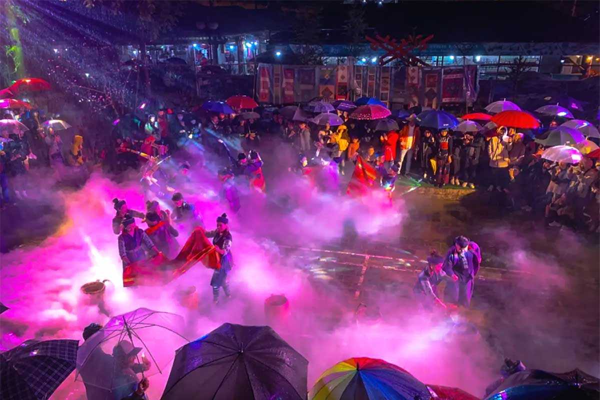 Sapa Love Market night festival with vibrant umbrellas and mist Sapa Love Market features a colorful night festival scene with locals under umbrellas, vibrant mist, and traditional costumes.