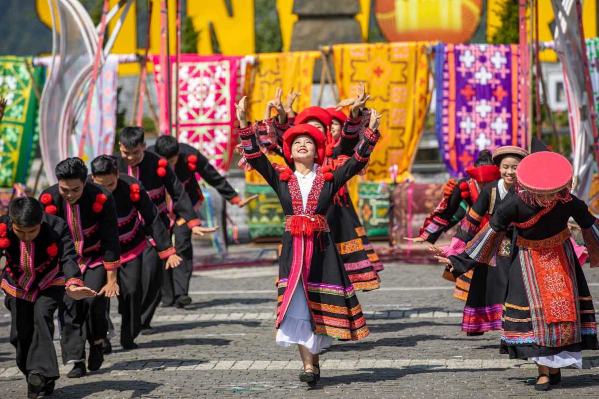 Sapa Love Market Vietnam colorful ethnic dance Sapa Love Market Vietnam showcases a vibrant ethnic group dance in traditional costumes under bright decorations.