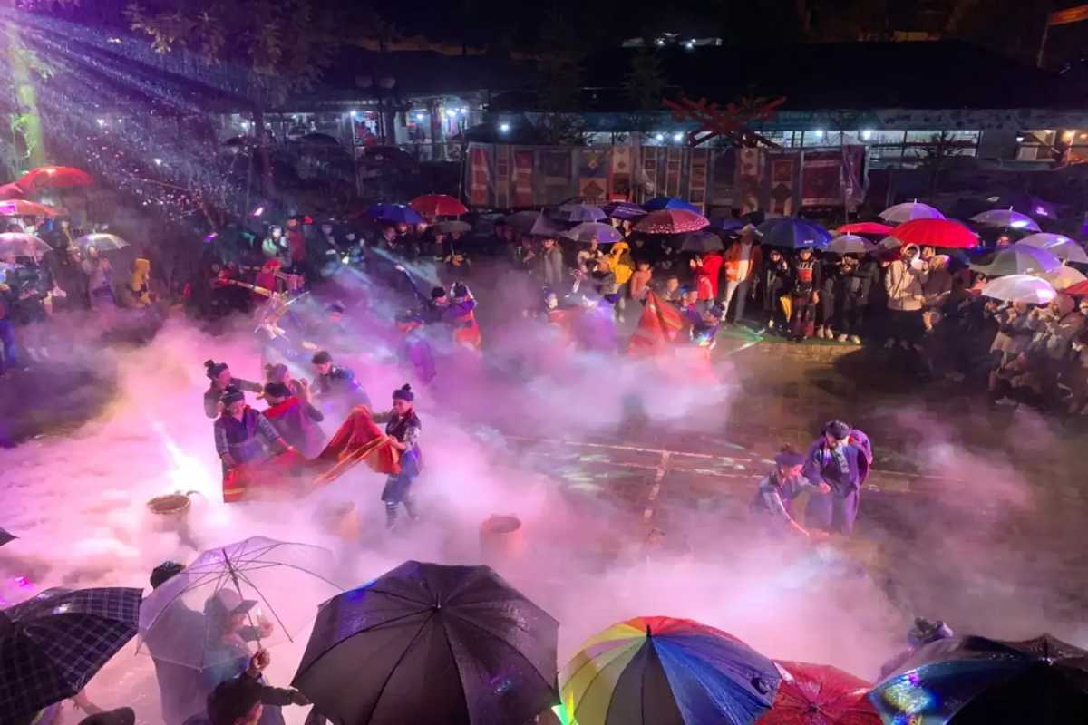 Sapa Night Market Crowd Shopping under Colorful Umbrellas Crowds shopping at various market stalls under colorful umbrellas during evening at Sapa Night Market.