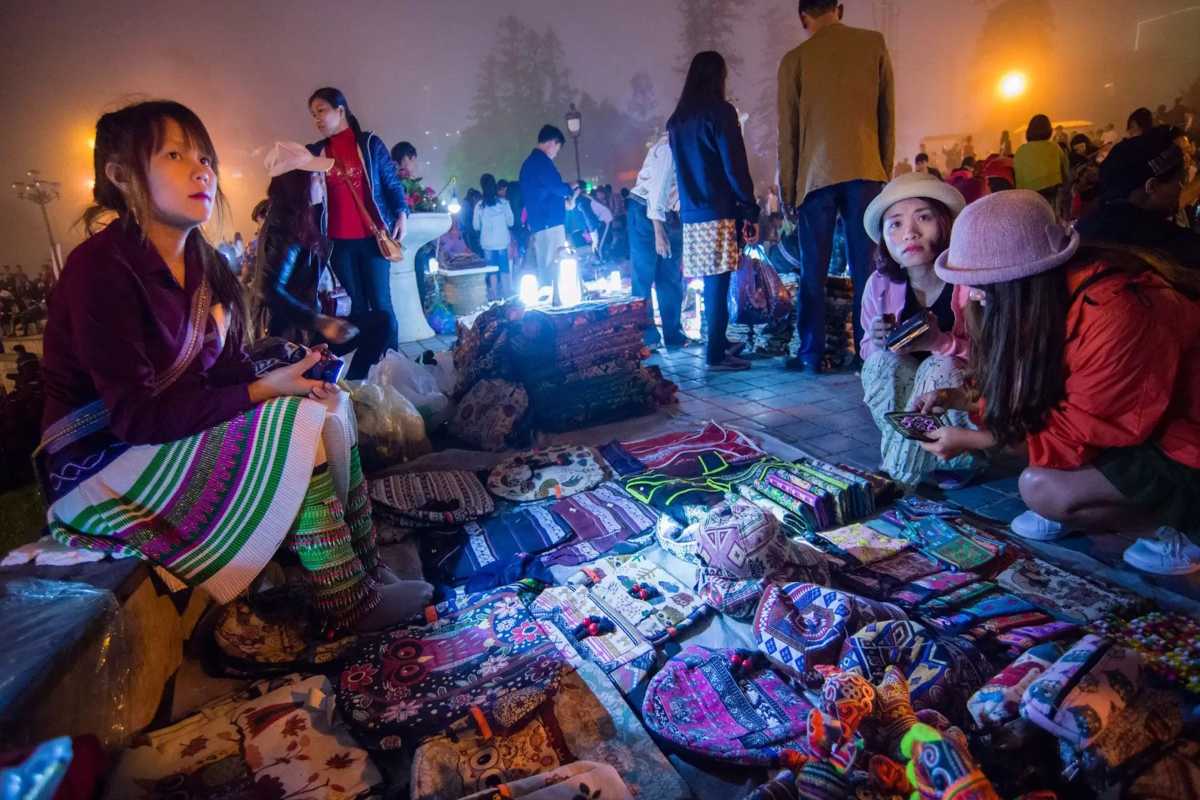Sapa Night Market Colorful Ethnic Textile Hats Colorful handwoven ethnic hats and textiles spread out on display at Sapa Night Market.