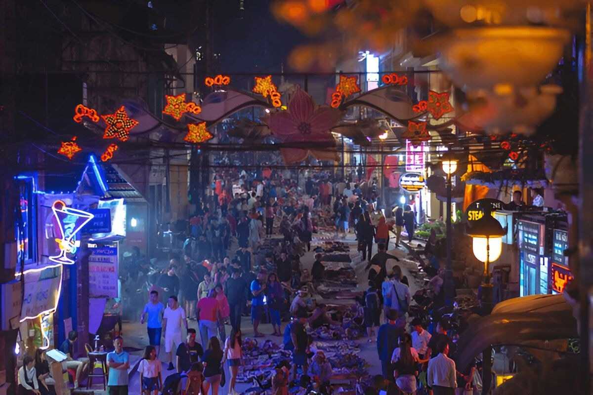 Sapa Night Market Evening Crowd and Neon Lights Evening crowd walking through the neon-lit bustling street of Sapa Night Market.