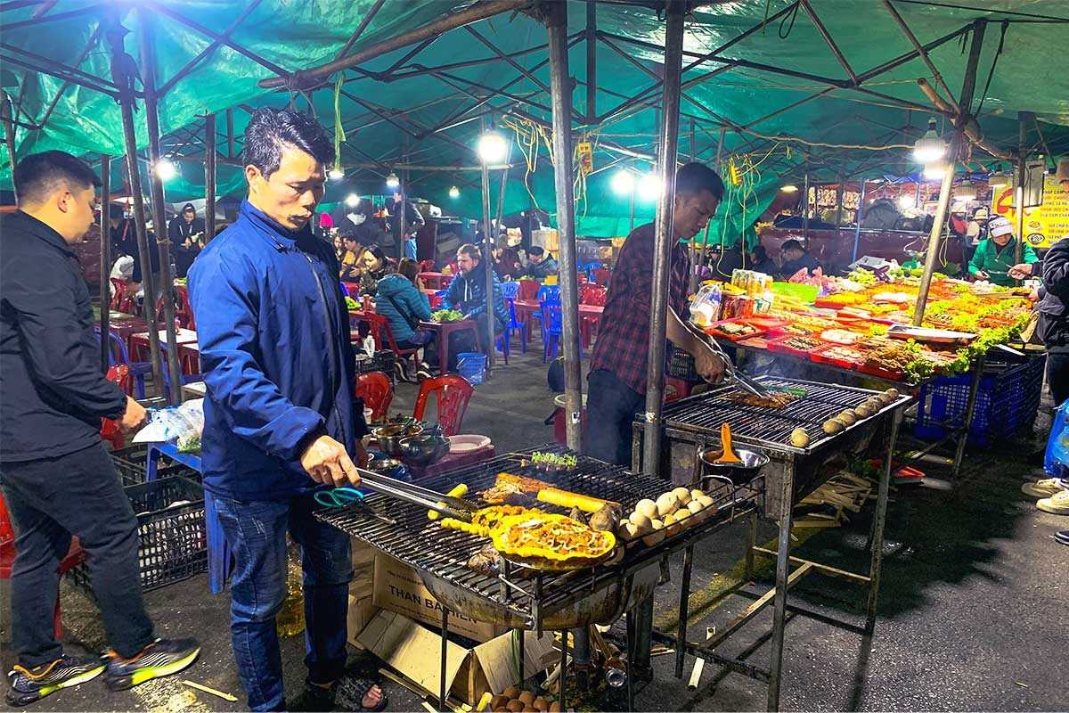 Sapa Night Market Vietnam busy shopping street at night Crowded shopping street at night in Sapa Night Market Vietnam with locals and tourists