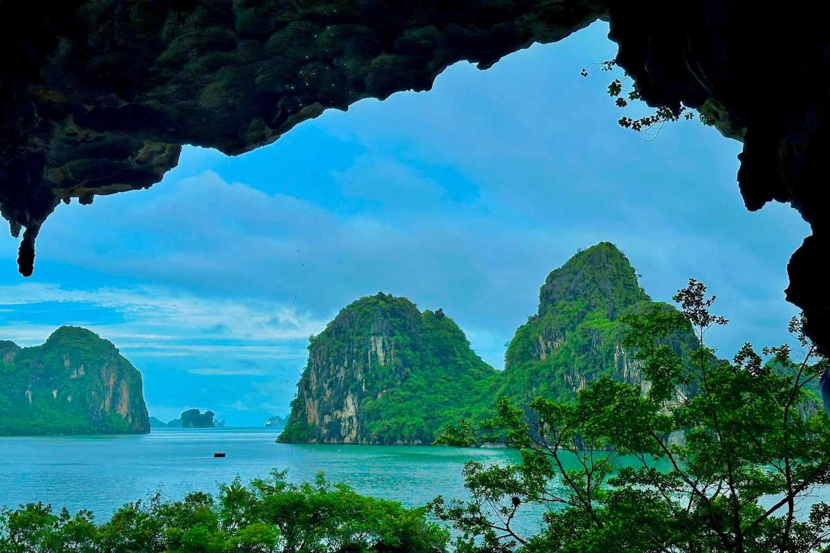 Scenic bay view from Drum Cave Halong Bay interior Panoramic view of the islands and sea from inside Drum Cave Halong Bay, highlighting the natural beauty around.