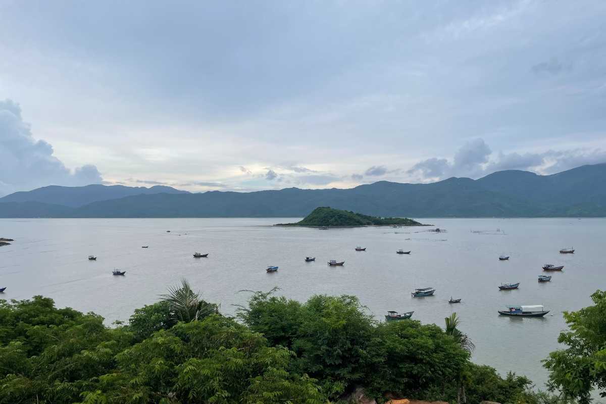 Scenic Coastal View of Nha Phu Lagoon Nha Trang Scenic coastal view with calm sea and greenery at Nha Phu Lagoon Nha Trang under a partly cloudy sky