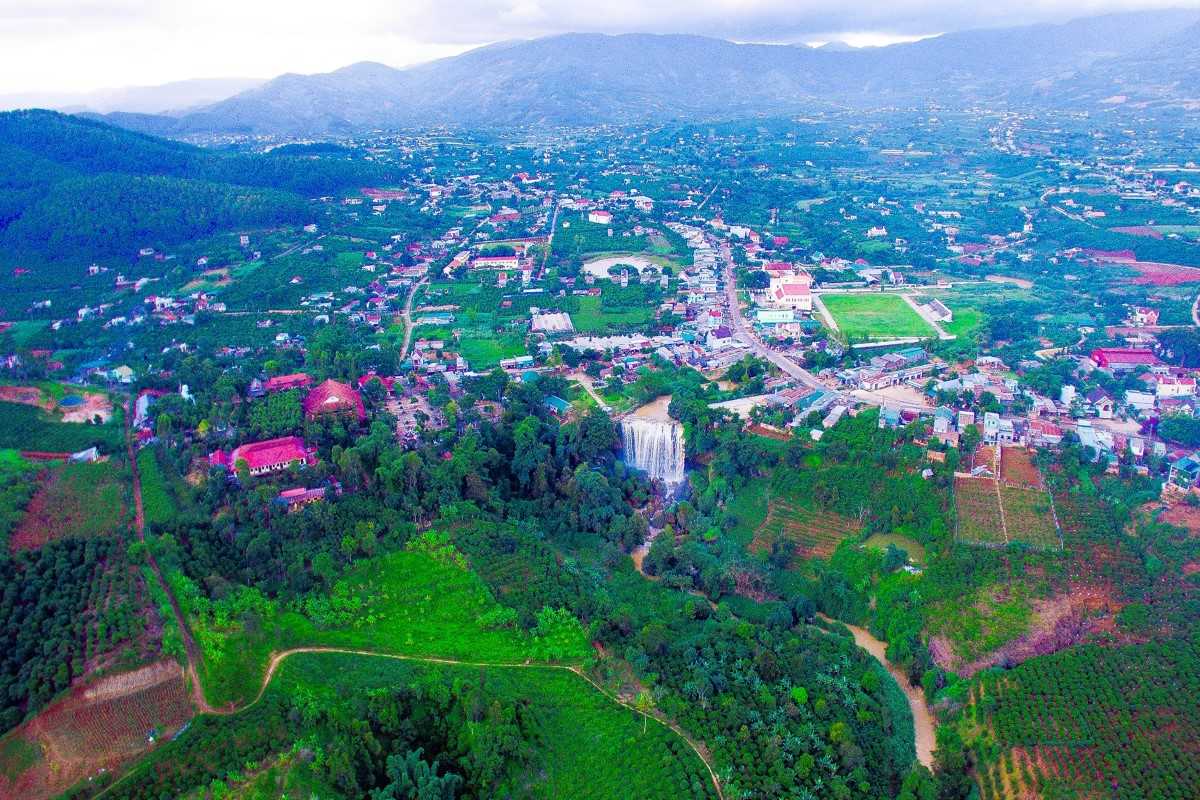 Scenic Elephant Falls Surrounded by Nature Scenic Elephant Waterfall surrounded by lush greenery and rocky terrain in Da Lat, Vietnam.