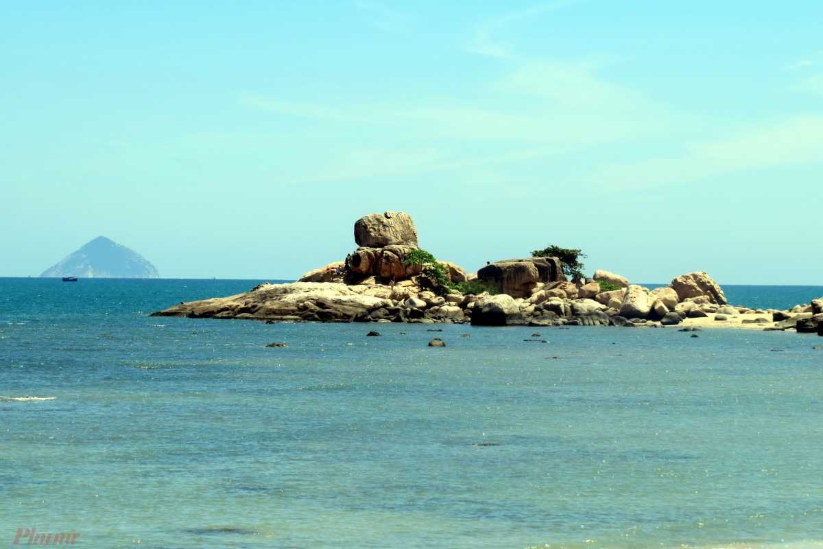 Serene Beachfront Resort Area at Nha Phu Lagoon Nha Trang Serene beachfront resort area with thatched roofs and greenery at Nha Phu Lagoon Nha Trang