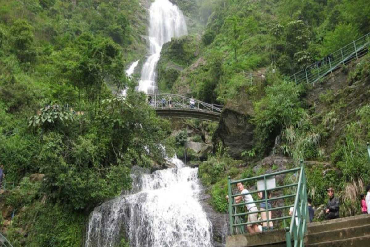 Silver Waterfall Sapa double bridge scenic forest Silver Waterfall Sapa’s dual bridges cross lush green forest and rushing waterfalls, inviting visitors to explore.