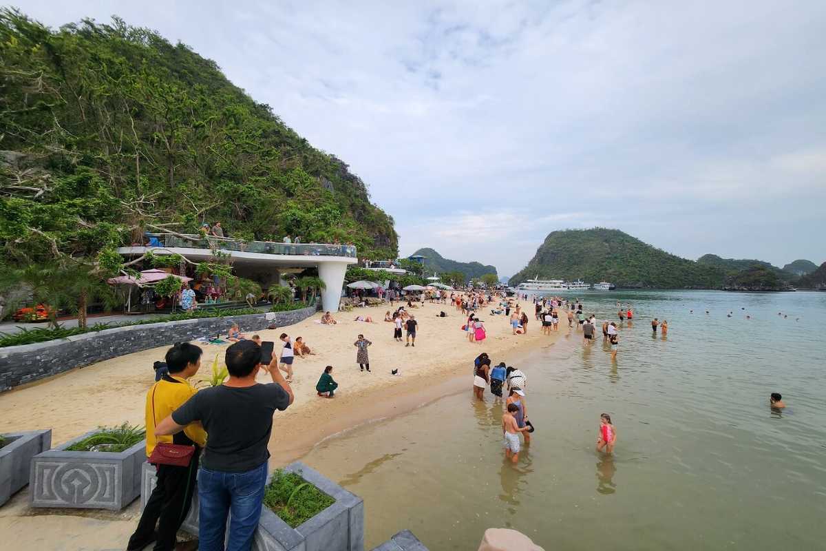 Soi Sim Island Halong Bay popular beach with tourists Soi Sim Island Halong Bay popular beach filled with visitors enjoying swimming and sunbathing