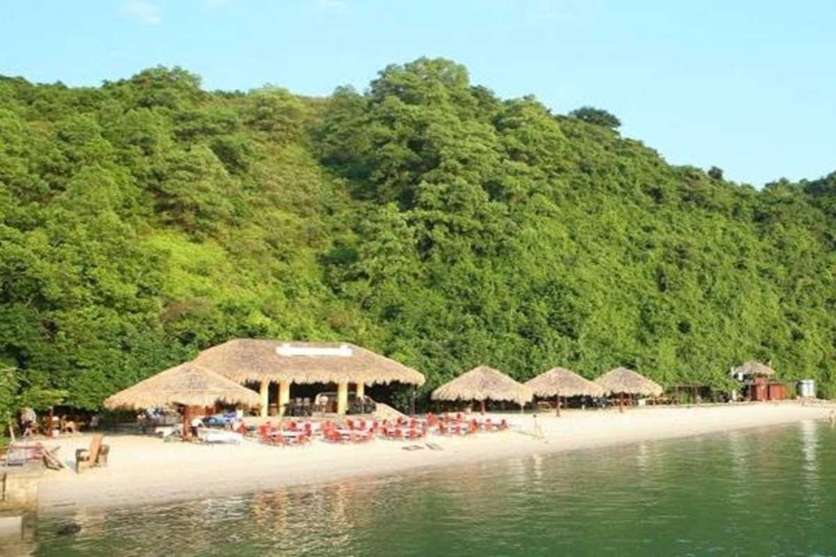 Soi Sim Island Halong Bay scenic beach with clear green water Scenic beach on Soi Sim Island Halong Bay with clear green waters and natural surroundings