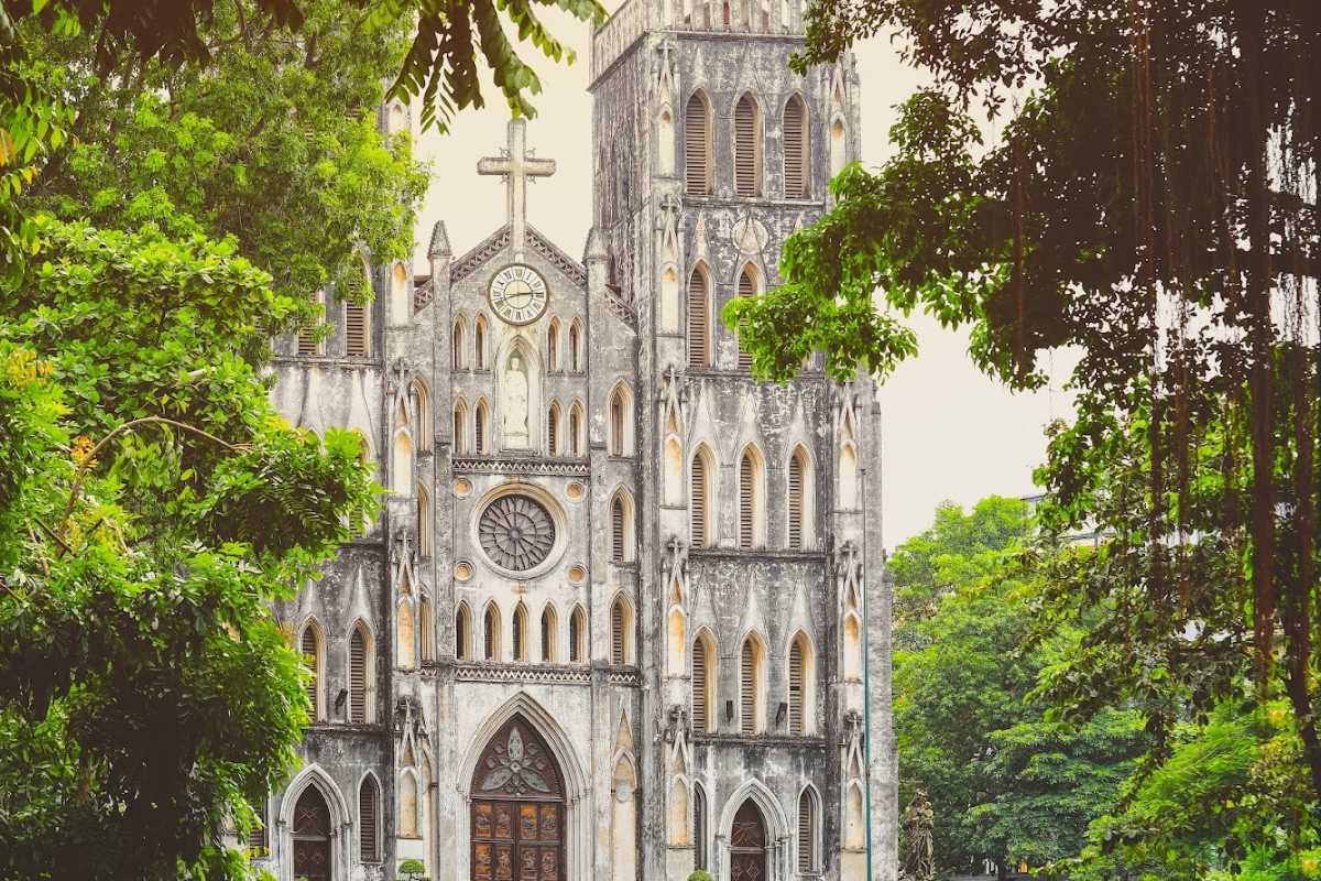St. Joseph Cathedral Hanoi Clock Tower Detail Close-up of the clock tower and cross on St. Joseph Cathedral Hanoi
