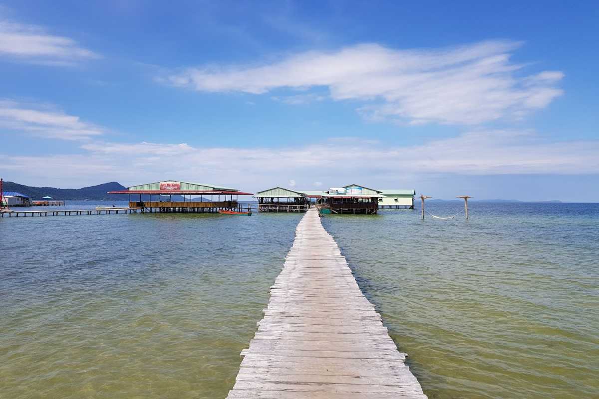 Starfish Beach Phu Quoc tire swing over sandy shore Tire swing hanging from wooden frame on sandy shore at Starfish Beach Phu Quoc