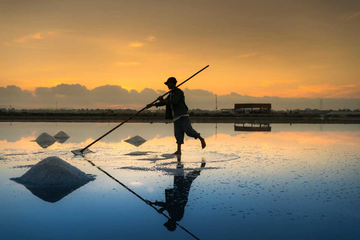 Sunset over Hon Khoi Salt Fields Beautiful sunset lighting reflecting on salt pans at Hon Khoi Salt Fields near Nha Trang.