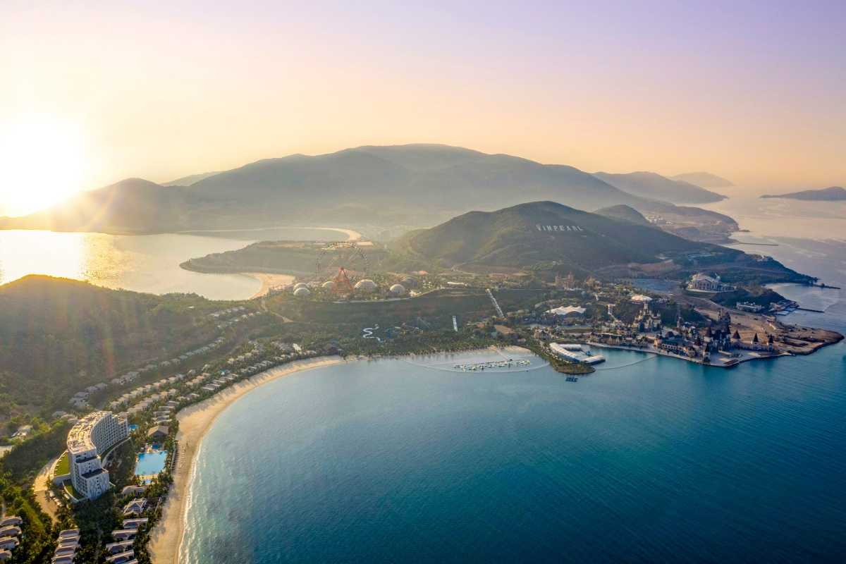 Sunset Over Hon Tre Island Golden-hour view of Hon Tre Island with sun setting over mountain ridges and sea