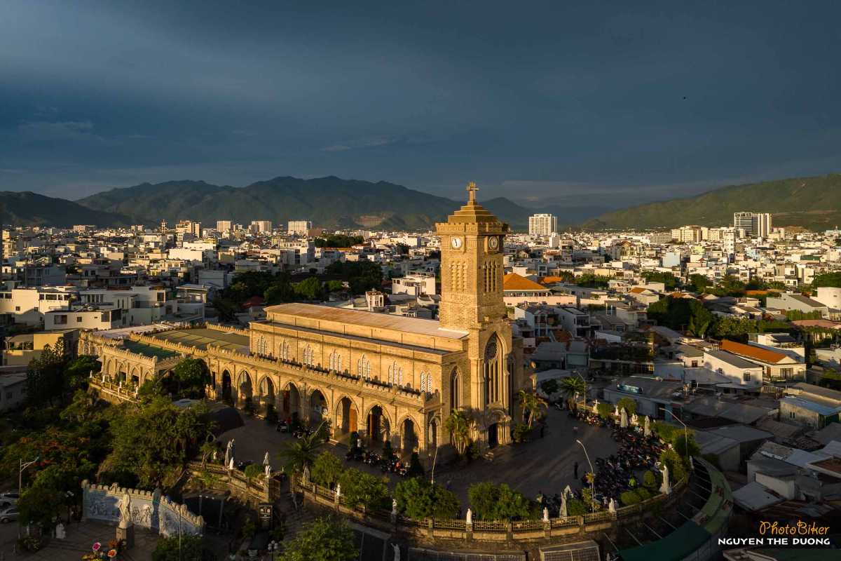 Stone Cathedral at Sunset Sunset light casts golden tones on the stone structure of Nha Trang Mountain Church and surrounding buildings