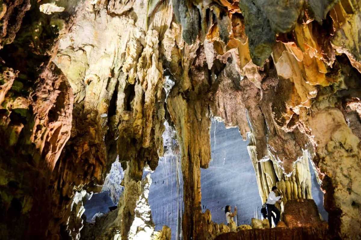 Ta Phin Village Sapa limestone cave interior Ta Phin Village Sapa limestone cave with unique stalactites and visitors exploring