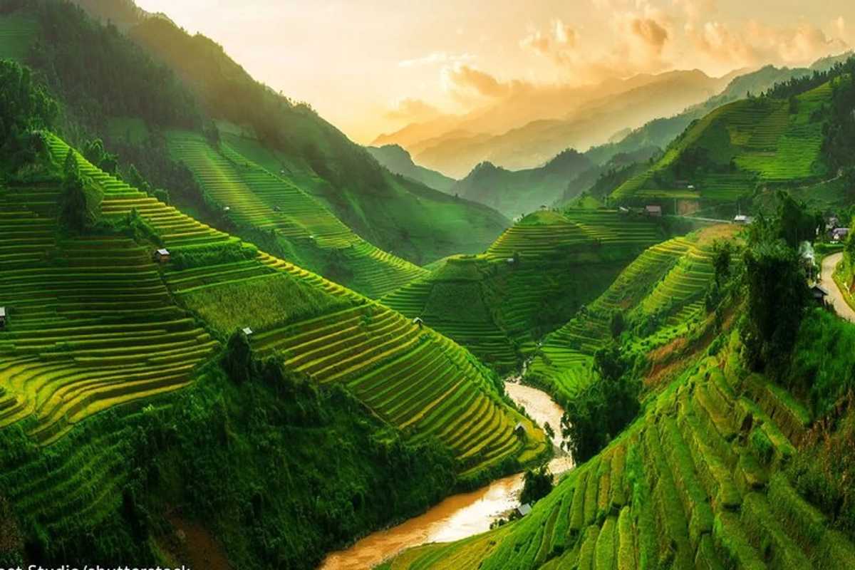 Ta Van Village Sapa Sunset Over Terraced Fields Sunset illuminating the terraced rice fields of Ta Van Village Sapa with misty mountains in the distance