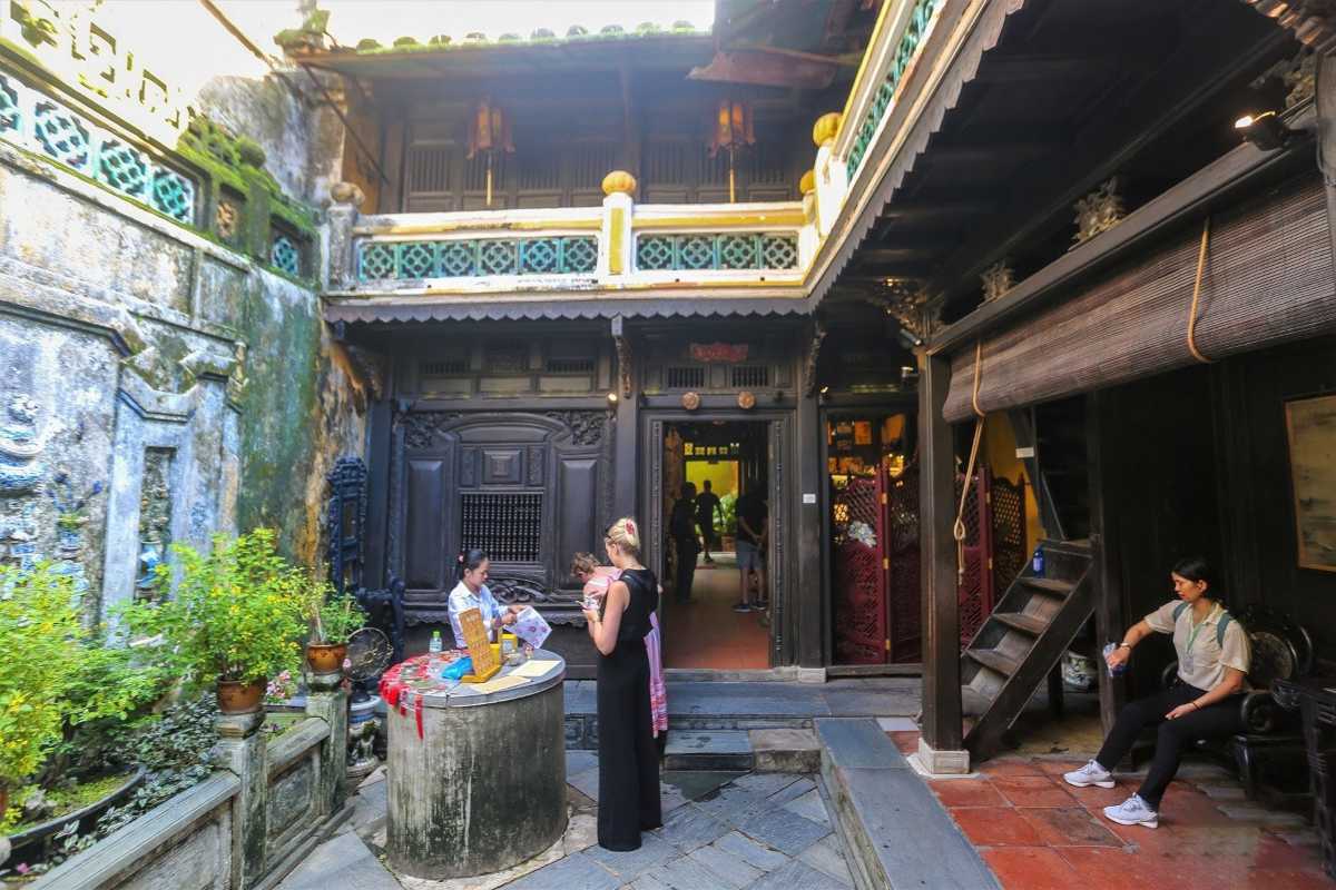 Courtyard Entrance of Tan Ky Ancient House Hoi An Courtyard entrance of Tan Ky Ancient House with visitors exploring the historic site