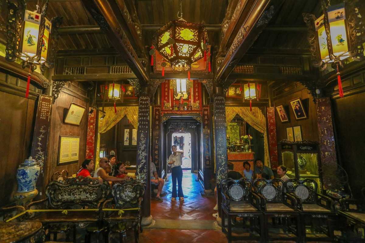 Interior View of Tan Ky Ancient House Hoi An Interior of Tan Ky Ancient House showing traditional wooden carvings and furniture
