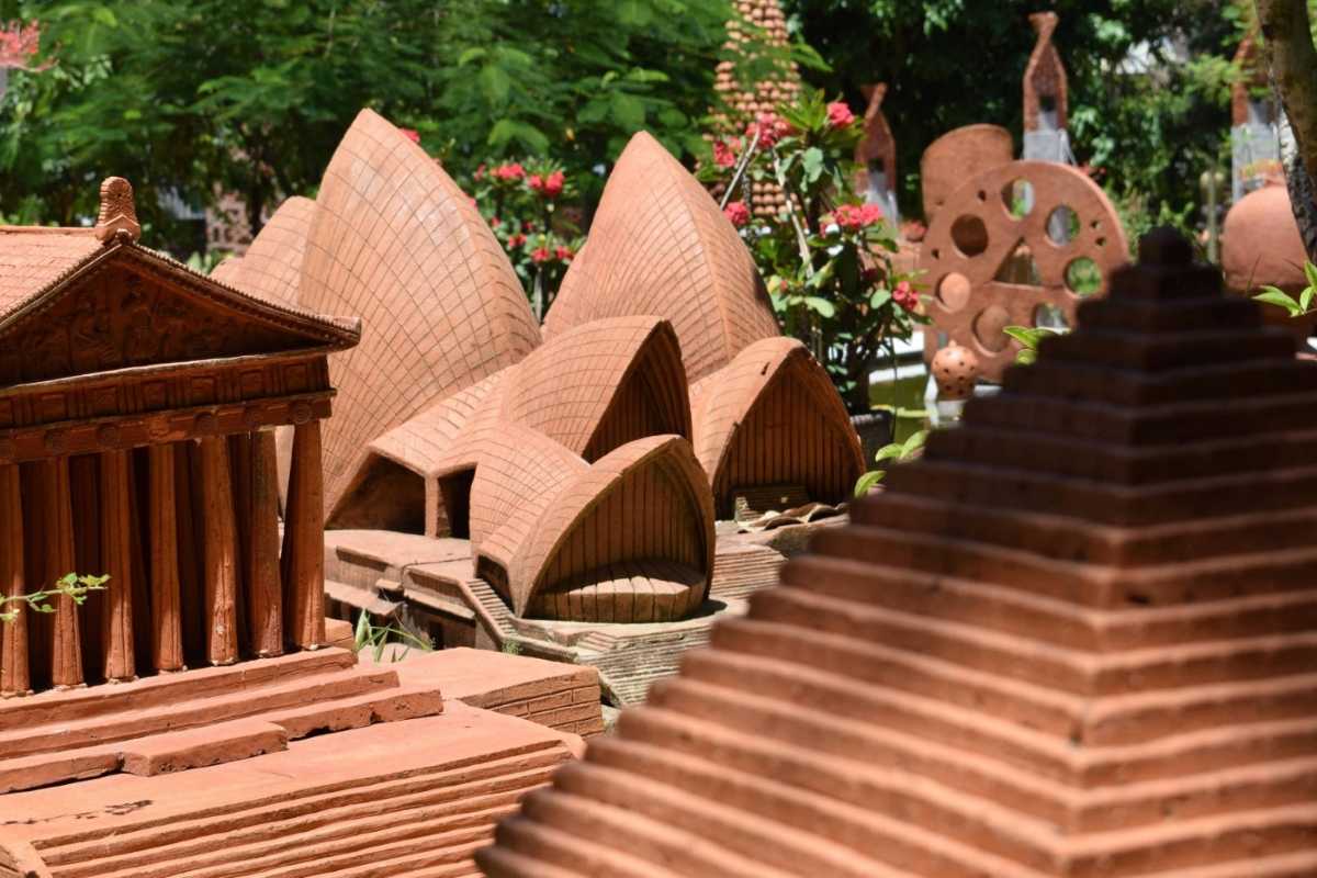 Detailed Terracotta Replica of Sydney Opera House Terracotta miniature of the Sydney Opera House displayed outdoors at Thanh Ha Pottery Village