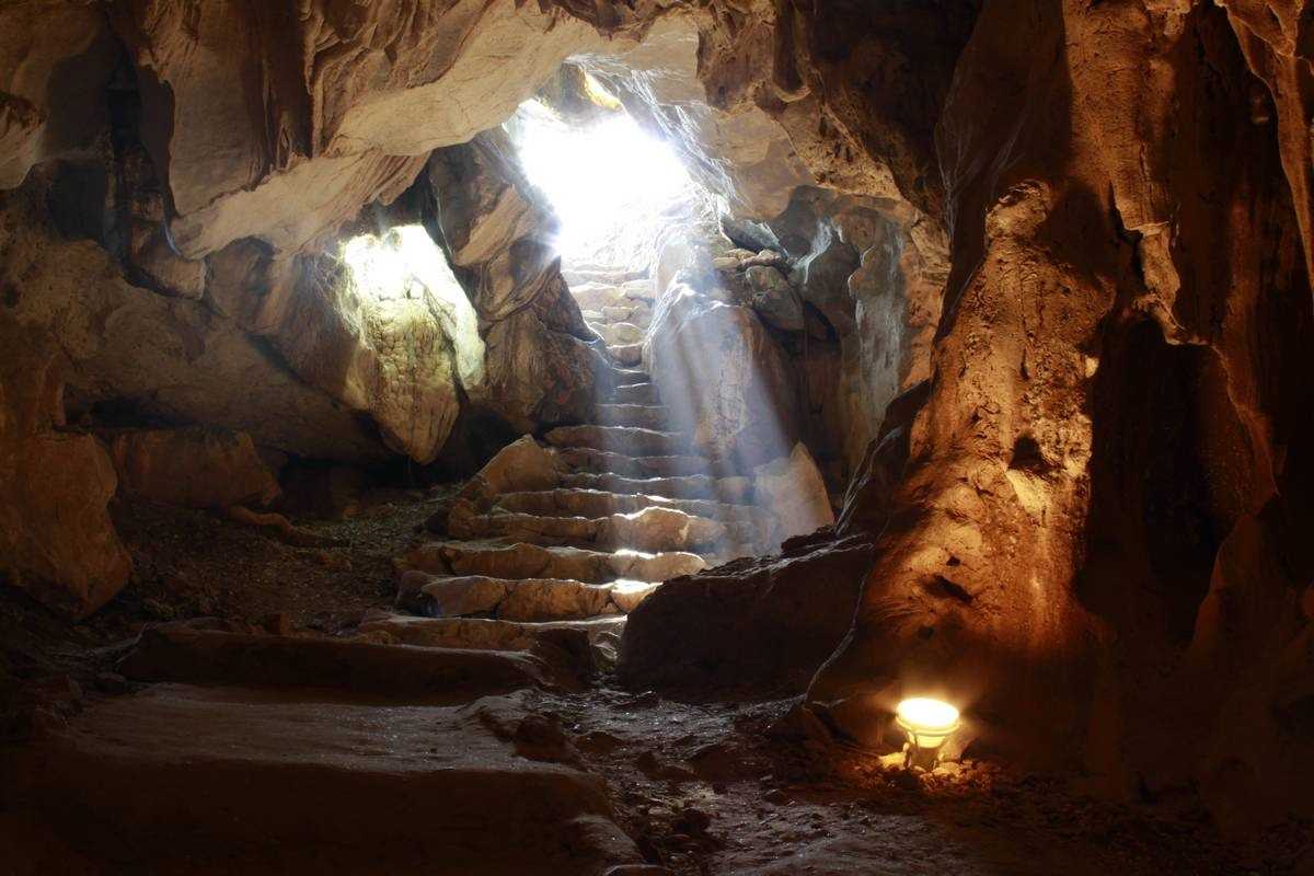 Brightly Lit Cave Chamber in Thien Canh Son Cave Wide chamber inside Thien Canh Son Cave brightly lit to showcase rock formations