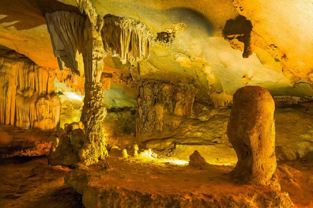 Pathway with Candle Lights Inside Thien Canh Son Cave Candle-lit pathway guiding visitors safely through parts of Thien Canh Son Cave