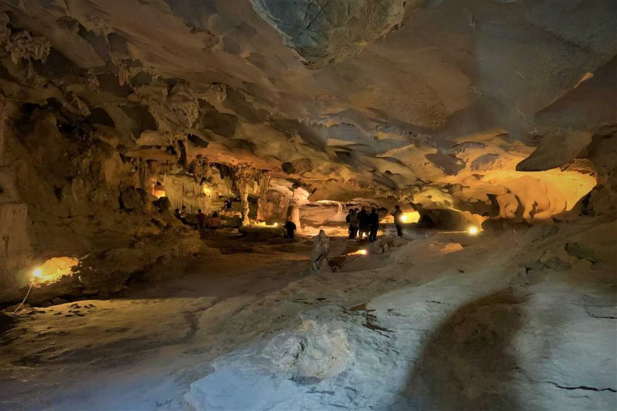 Vibrant Colored Lighting in Thien Canh Son Cave Multicolored lighting illuminating different rock formations inside Thien Canh Son Cave