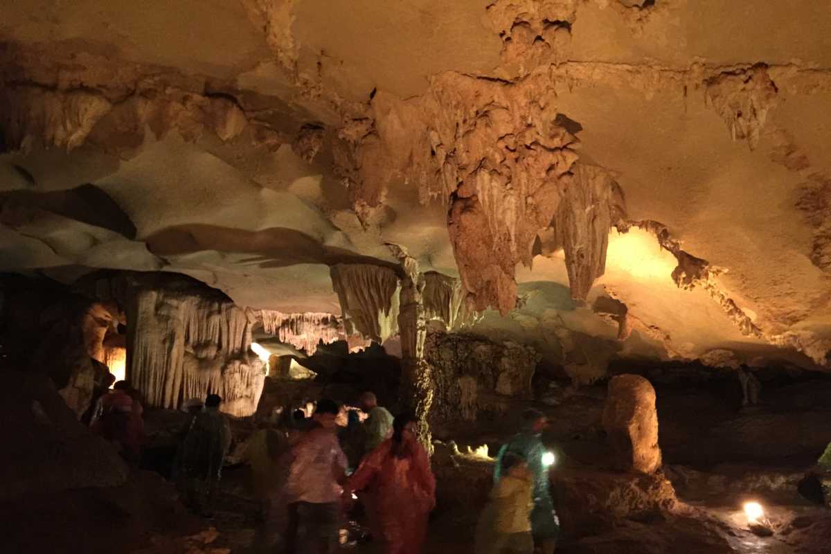 Entrance View of Thien Canh Son Cave in Quang Ninh Entrance view of Thien Canh Son Cave with natural light streaming in at Bai Tu Long Bay, Quang Ninh