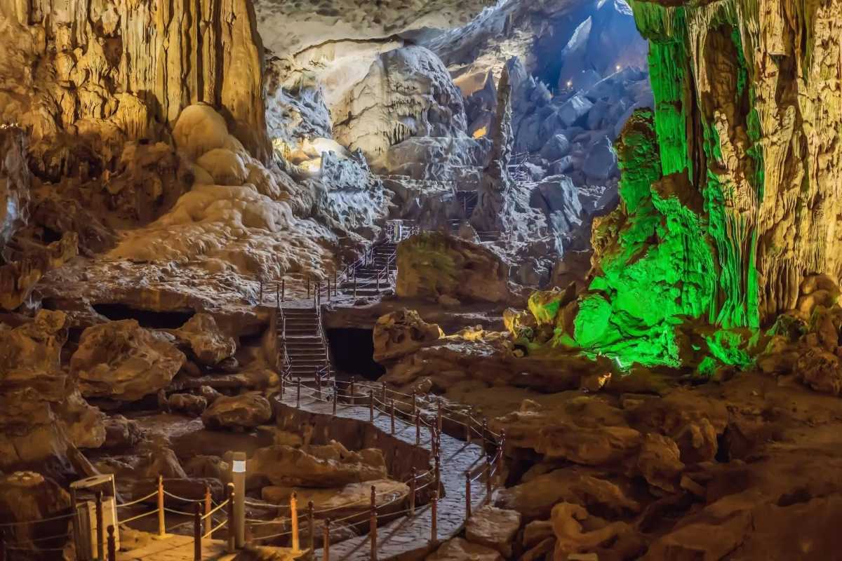 Green and Blue Lighting Effects Inside Thien Canh Son Cave Green and blue lighting effects illuminating rock formations inside Thien Canh Son Cave
