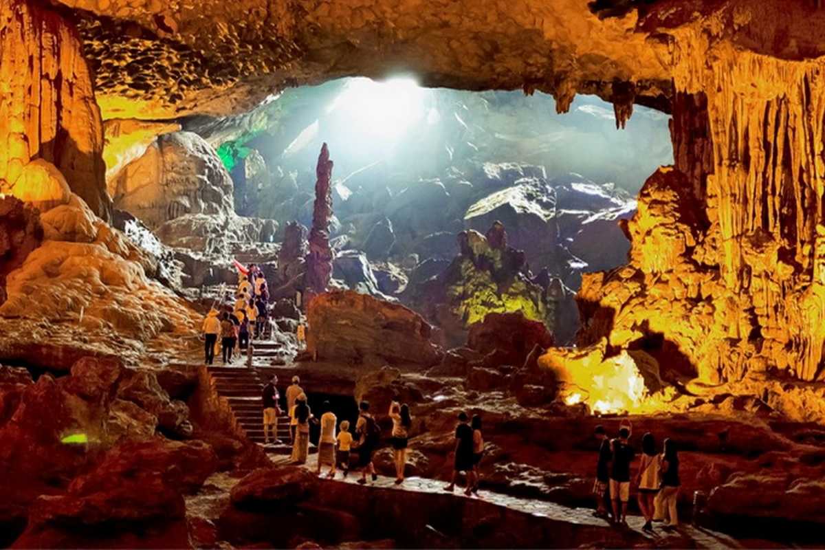 Thien Cung Cave Halong Bay illuminated stalactites Thien Cung Cave Halong Bay highlights illuminated stalactites and stalagmites creating a magical underground scene