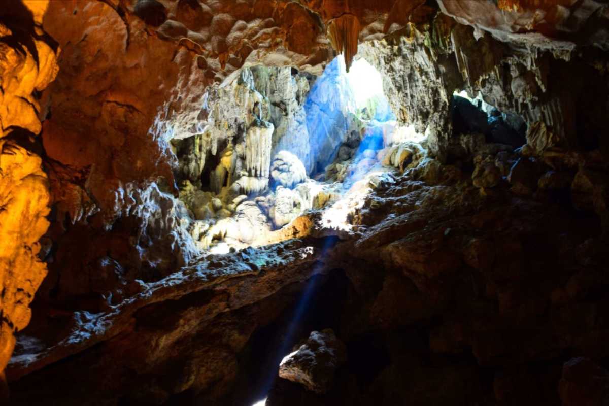 Thien Cung Cave Halong Bay natural limestone formations Thien Cung Cave Halong Bay showcasing stunning natural limestone formations illuminated by sunlight rays