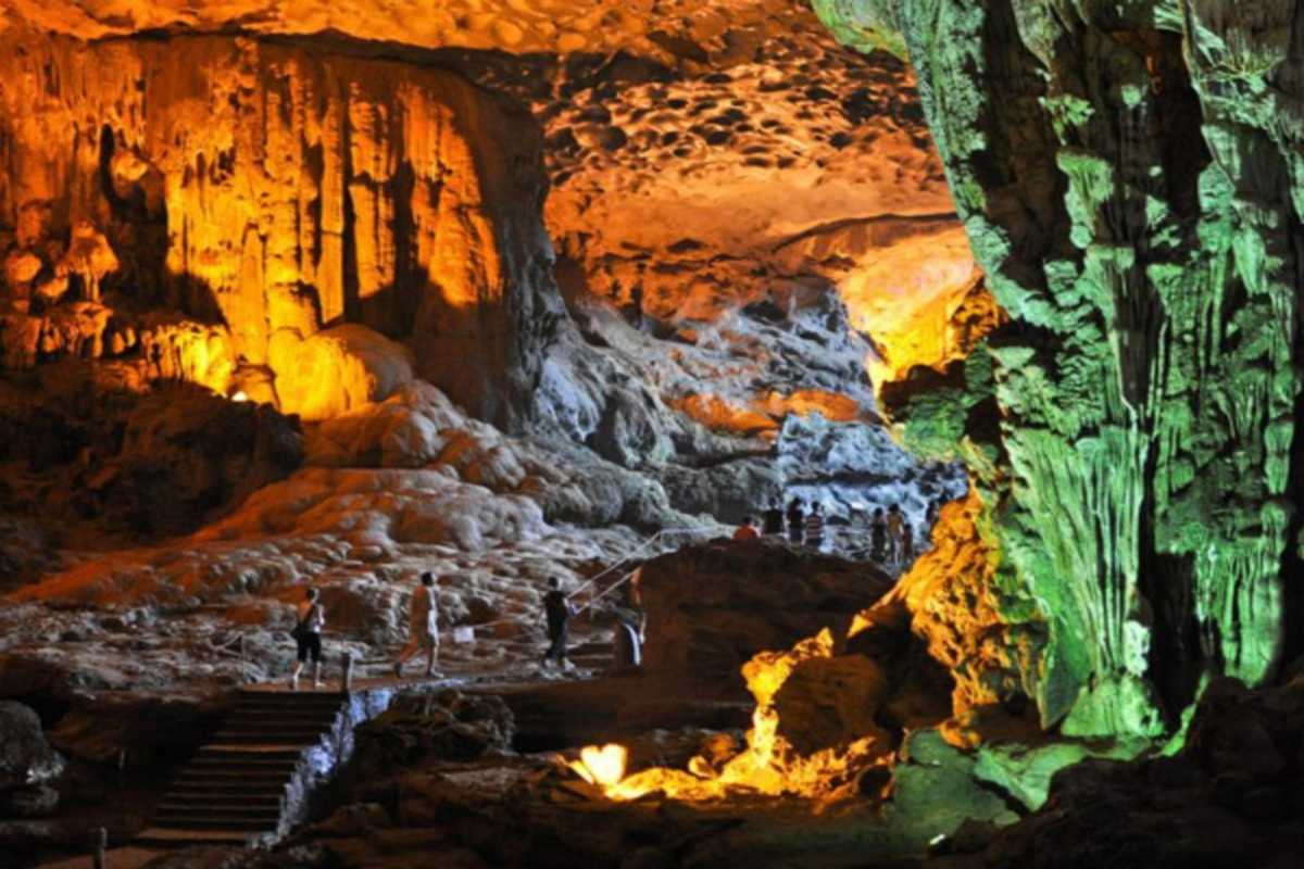 Thien Cung Cave Halong Bay tourists exploring pathways Thien Cung Cave Halong Bay welcomes tourists exploring safe, well-lit pathways through fascinating cave chambers