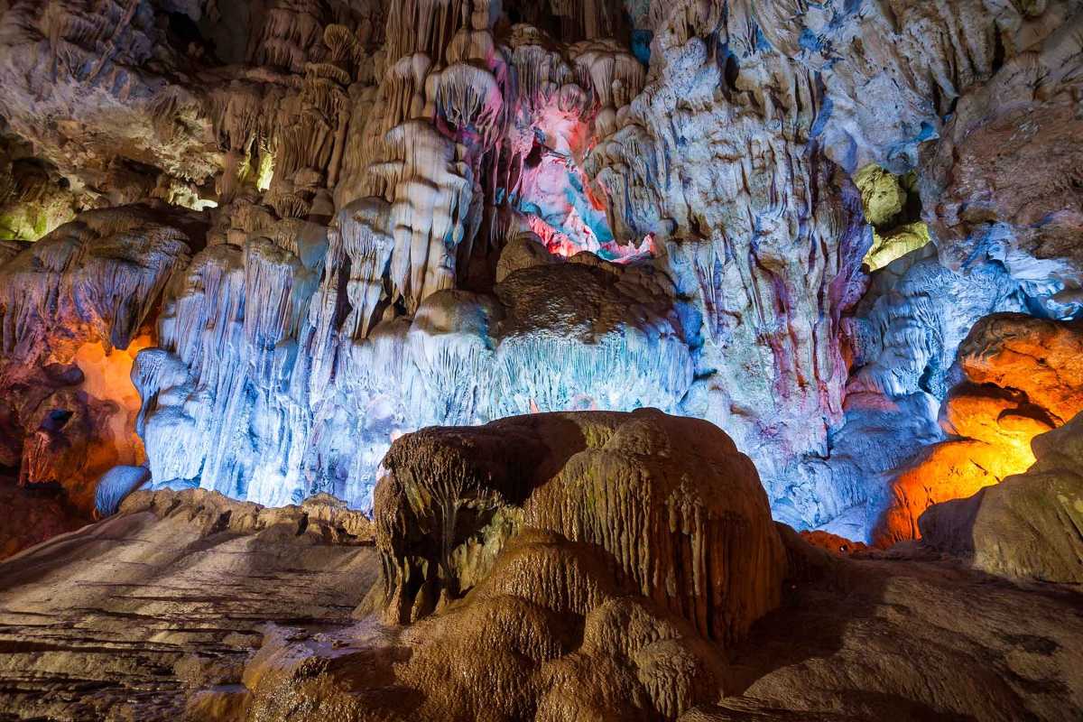Thien Cung Cave Halong Bay vibrant stalactite formations Thien Cung Cave Halong Bay displays vibrant stalactite formations illuminated by colorful lighting effects