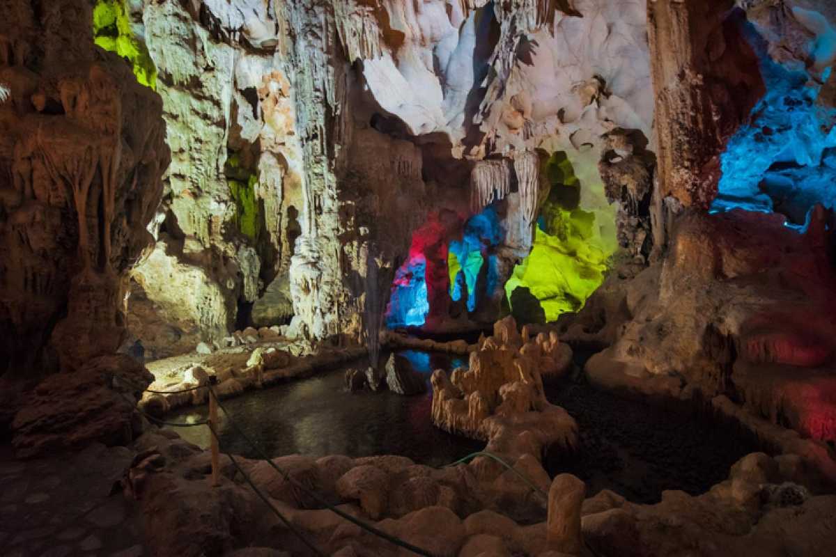 Thien Cung Cave Halong Bay vivid underground scenery Thien Cung Cave Halong Bay offers vivid underground scenery with colorful limestone structures and pools