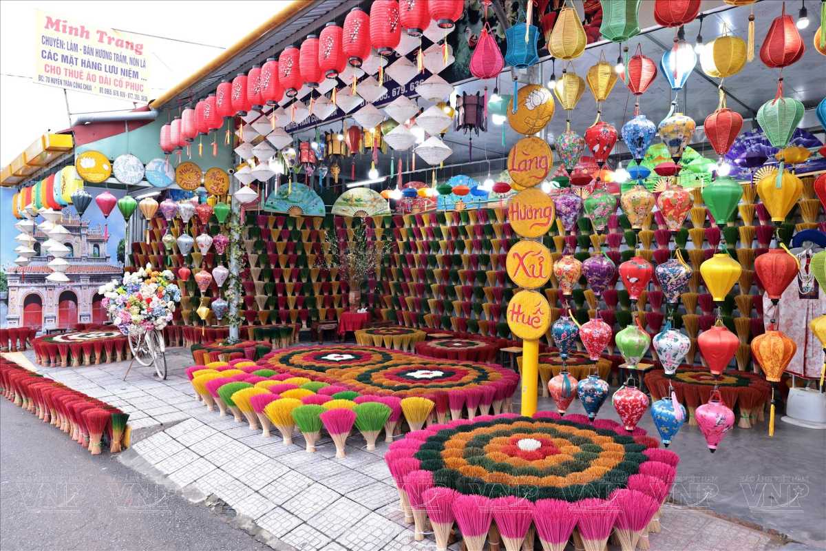 Vibrant incense stick bundles and lanterns at Thuy Xuan Incense Village in Hue showcasing traditional Vietnamese craftsmanship.