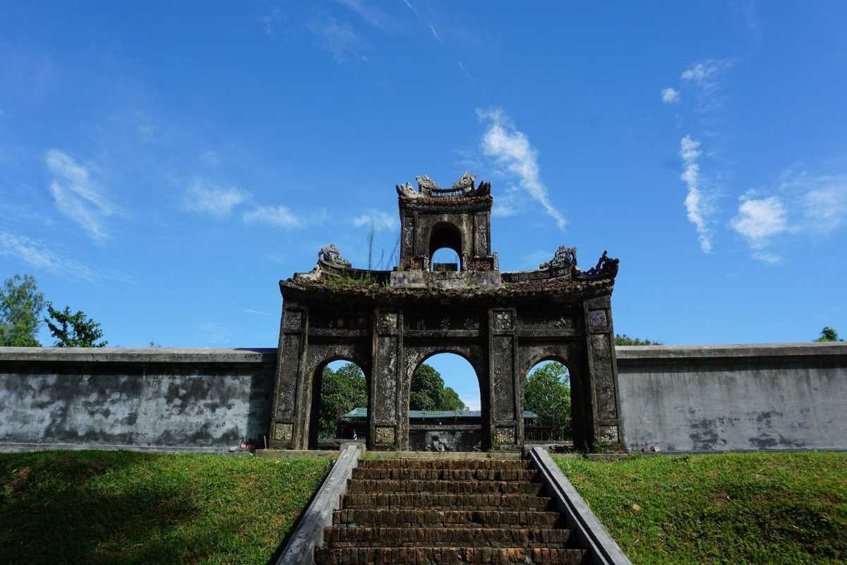 Tiger Arena Hue iconic three-arched ceremonial gateway Tiger Arena Hue showcases its iconic three-arched ceremonial gateway with intricate stone carvings and a grand stairway in front.