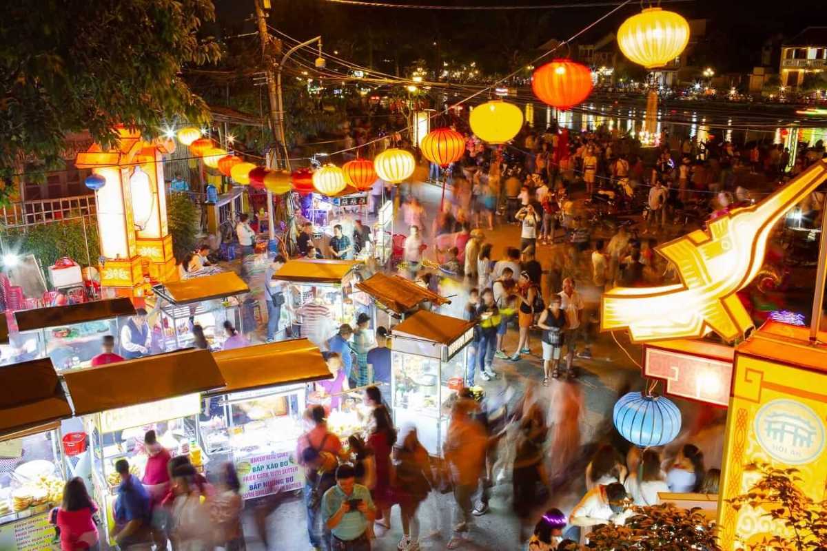 Tourist Boat on Hoai River at Night in Hoi An Night Market Tourist boat decorated with lanterns floating on Hoai River under night sky during Hoi An Night Market