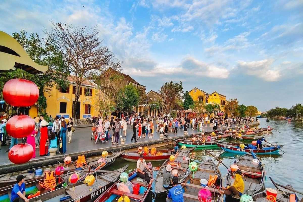 Traditional Boats Docked by Japanese Bridge in Hoi An Traditional wooden boats moored near the Japanese Bridge Hoi An along the Thu Bon River.