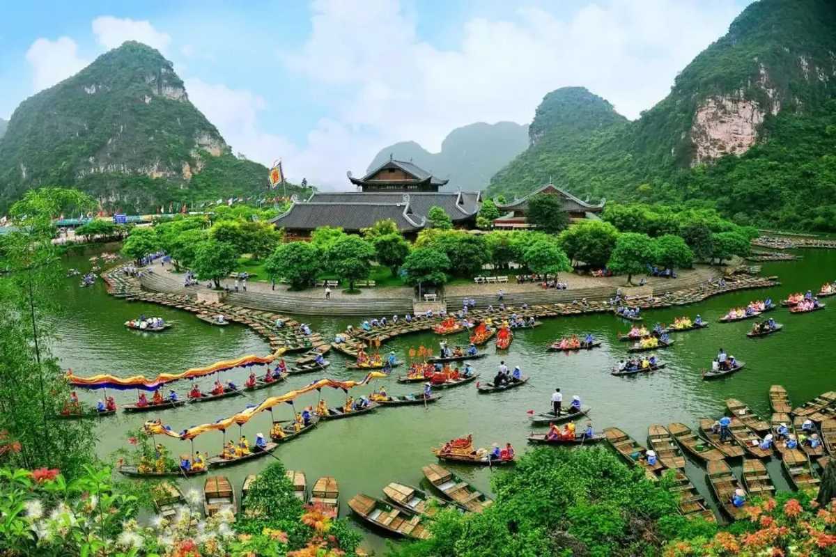 Traditional Boats at Trang An Ninh Binh Cultural Festival Colorful traditional boats gathering during a festival on the water at Trang An Ninh Binh
