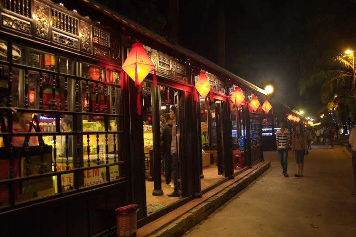 Traditional Lanterns Lighting Nguyen Dinh Chieu Street Traditional square lanterns hanging above the wooden shops on Nguyen Dinh Chieu Walking Street at night
