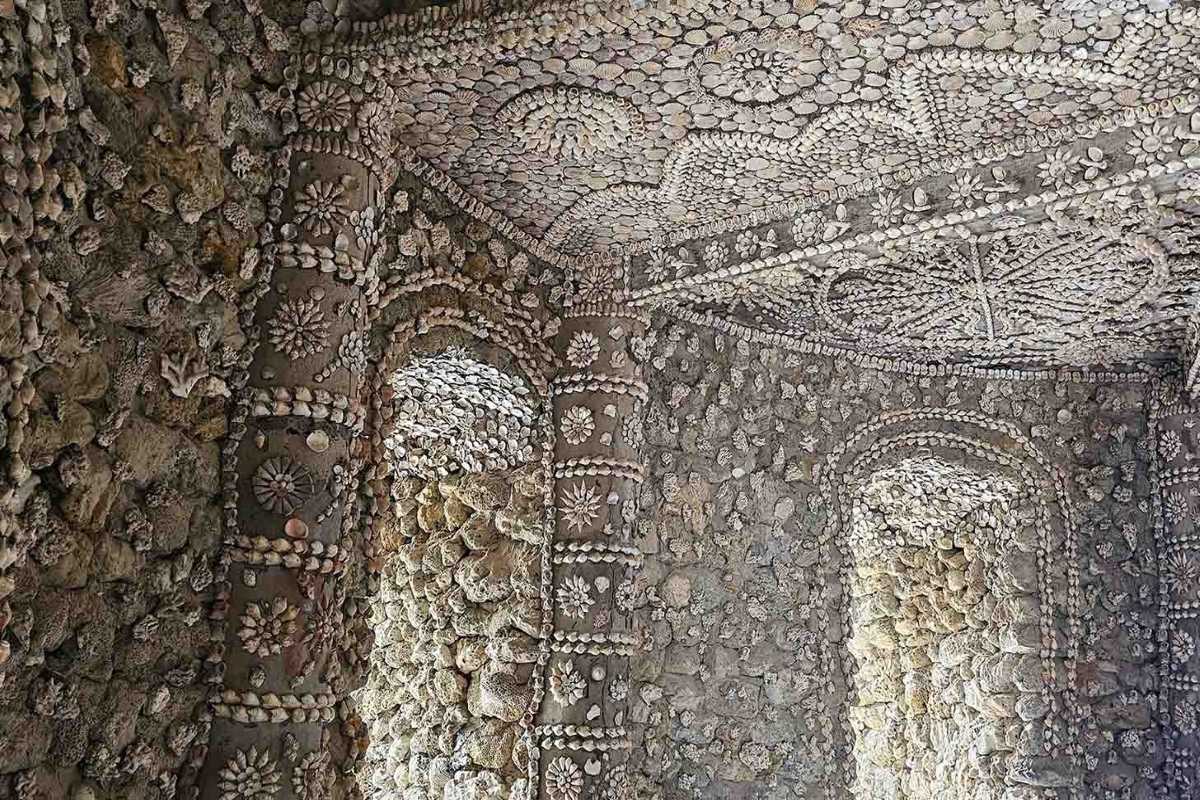 Tu Van Pagoda Nha Trang Detailed Stone Shell Mosaic Wall Close-up of Tu Van Pagoda Nha Trang shell mosaic stone wall showcasing intricate floral patterns