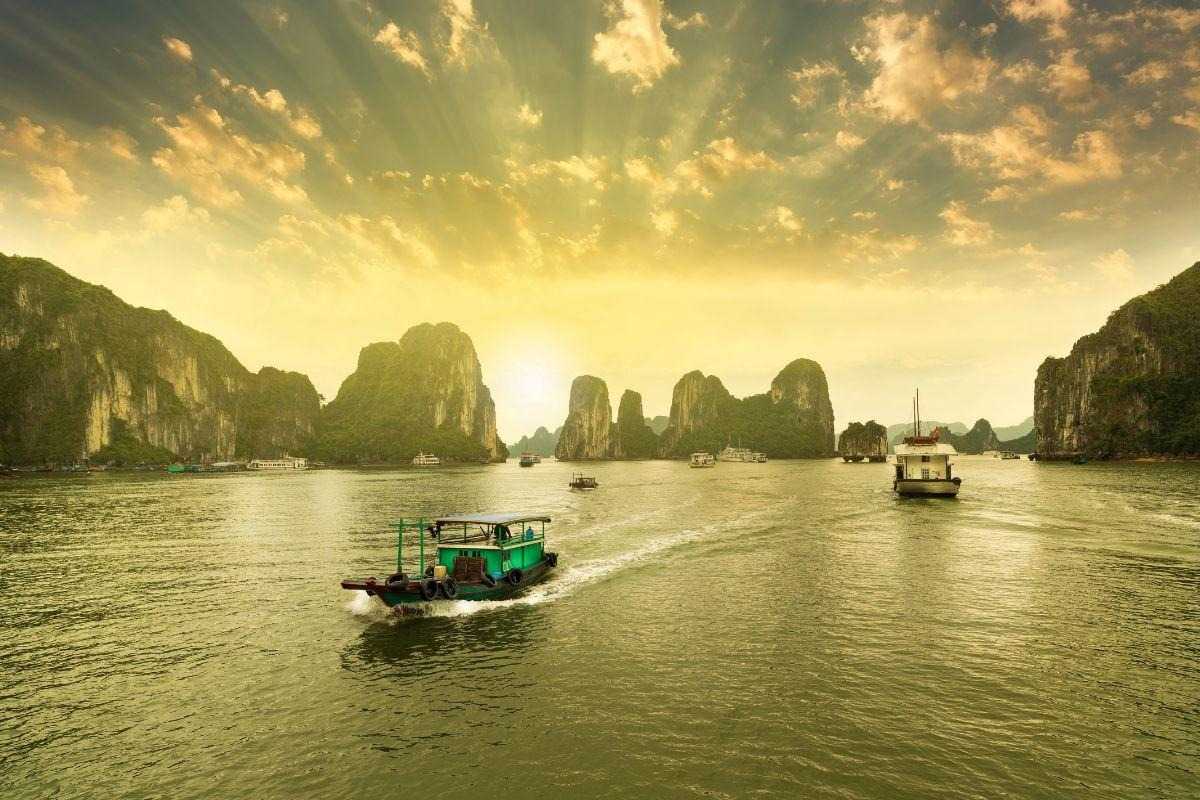 Tung Sau Pearl Farm Halong Bay Pearl Farmer Activity Pearl farmers in traditional conical hats working on boats at Tung Sau Pearl Farm Halong Bay