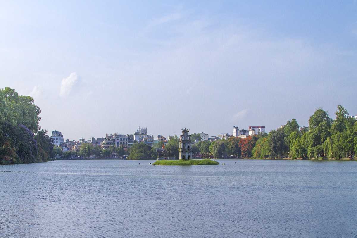 Turtle Tower Hanoi Panorama from Distance Panoramic image of Turtle Tower located in Hoan Kiem Lake with Hanoi cityscape in the background