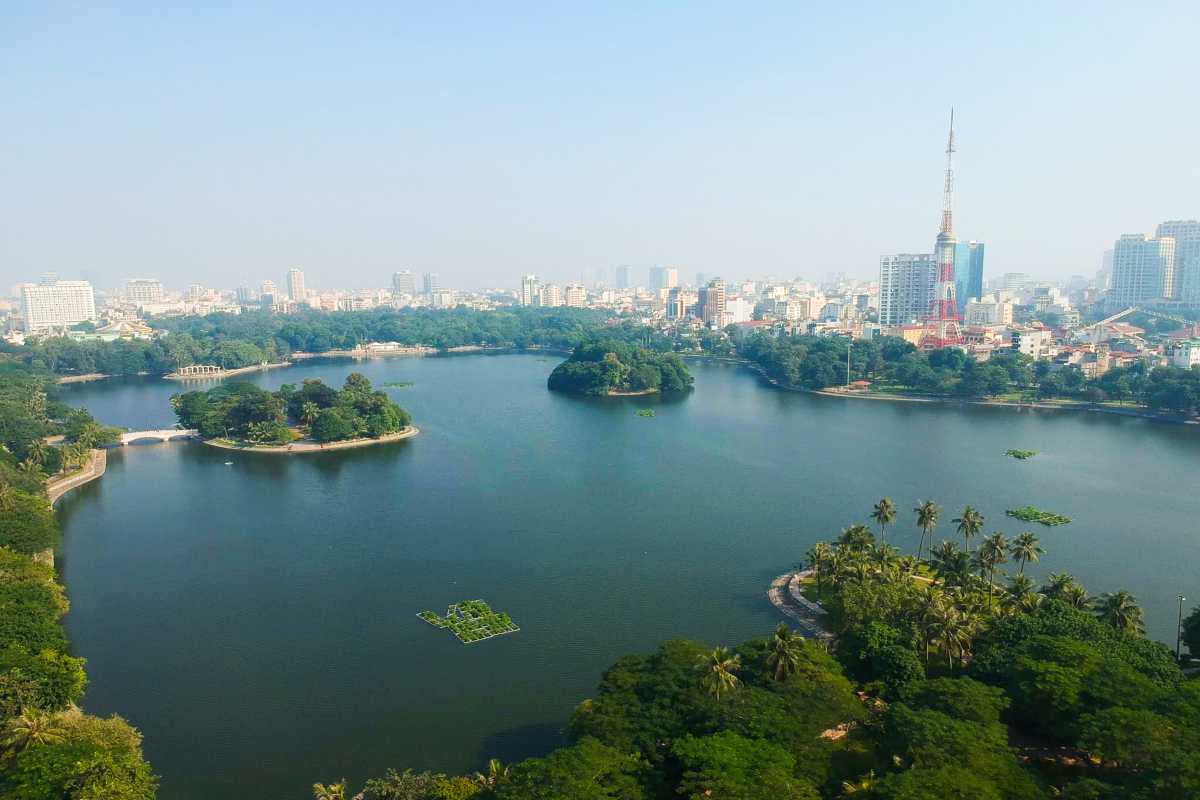 Wide Landscape of Turtle Tower and Hoan Kiem Lake Expansive aerial view of Turtle Tower and green surroundings at Hoan Kiem Lake, Hanoi