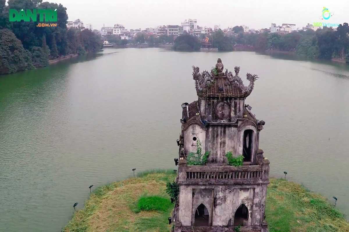 Turtle Tower through Willow Branches View of Turtle Tower partially obscured by hanging willow branches on Hoan Kiem Lake
