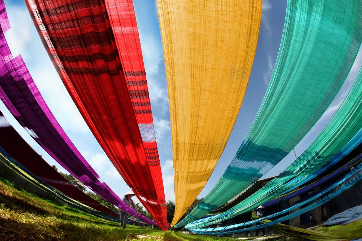 Van Phuc Silk Village Umbrella Decorations Colorful umbrella decorations brighten street view at Van Phuc Silk Village, enhancing visitor appeal.